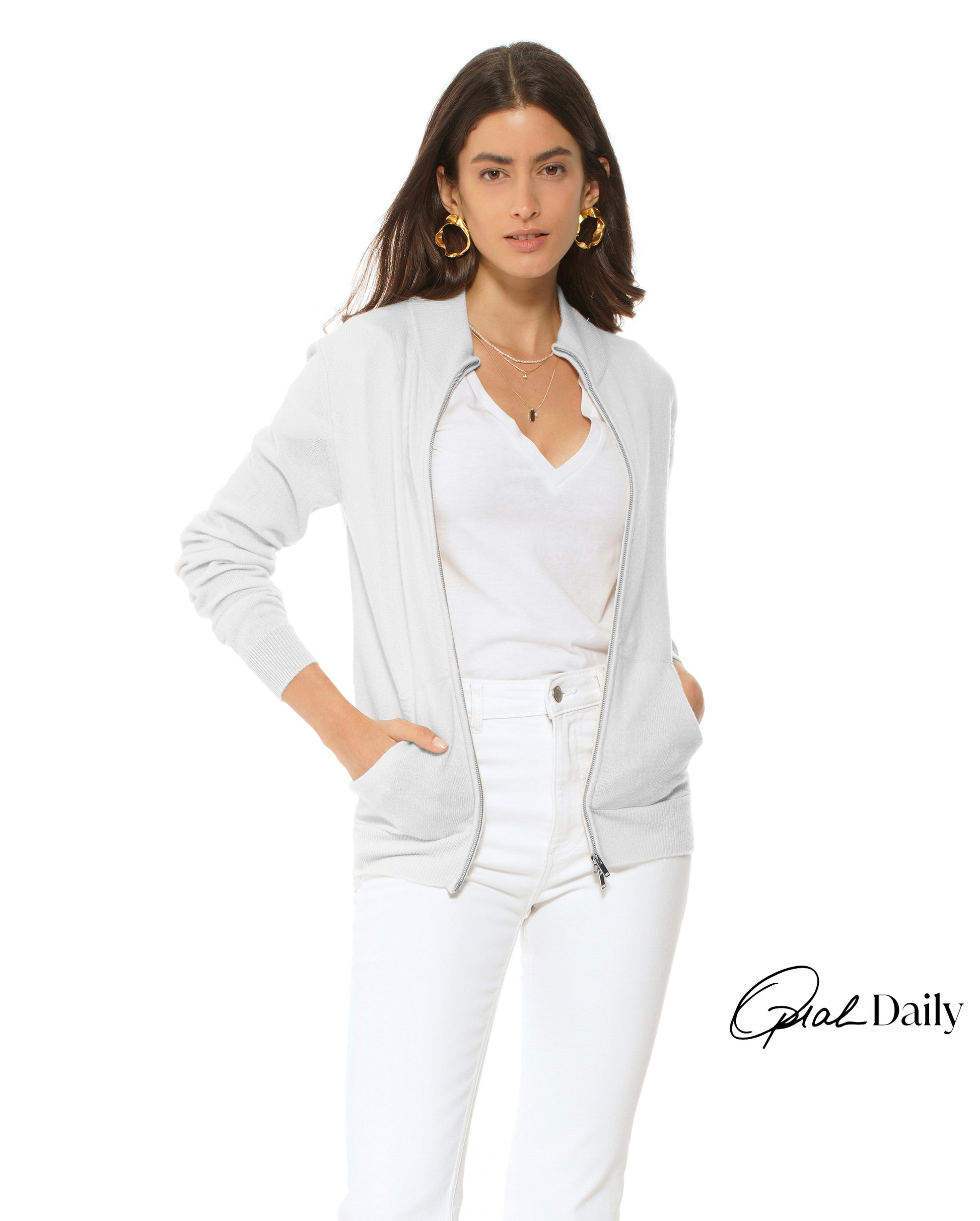 Woman wearing a white outfit with a jacket and pants on a white background