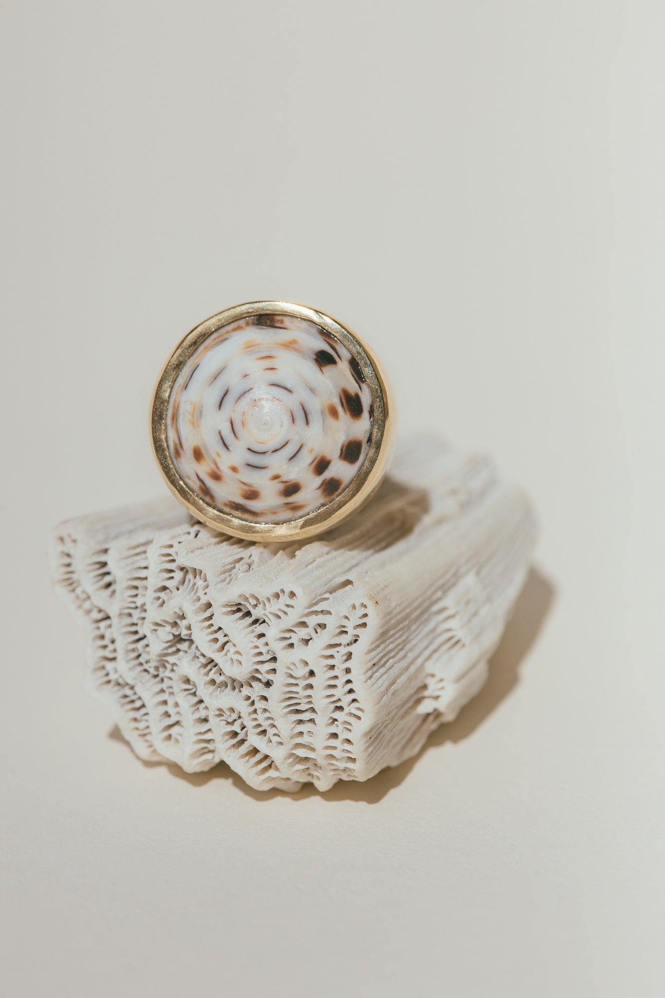 A CLOSE UP OF THE 18K GOLD PUKA RING-ONE-OF-A-KIND-PATTERN