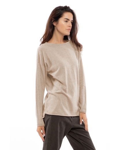 Beige cashmere relaxed maxi boatneck sweater, three-quarter view on a model.