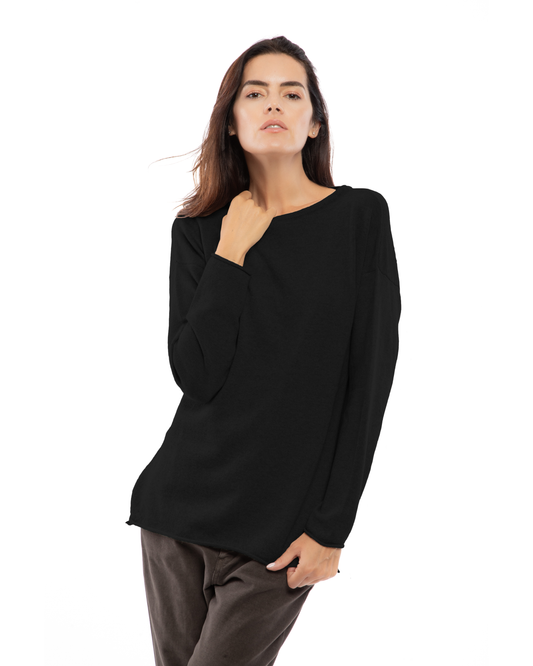 Black cashmere boatneck sweater, shown from the front on a model.