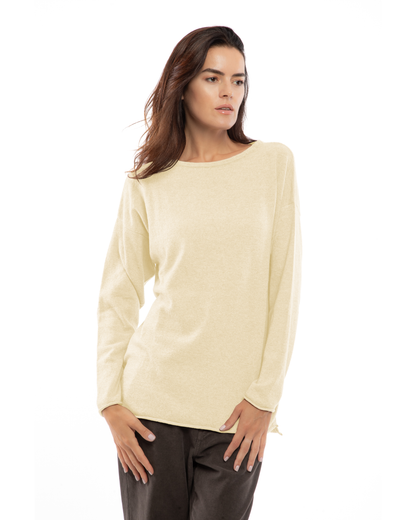 Butter yellow cashmere boatneck sweater, shown from the front on a model.