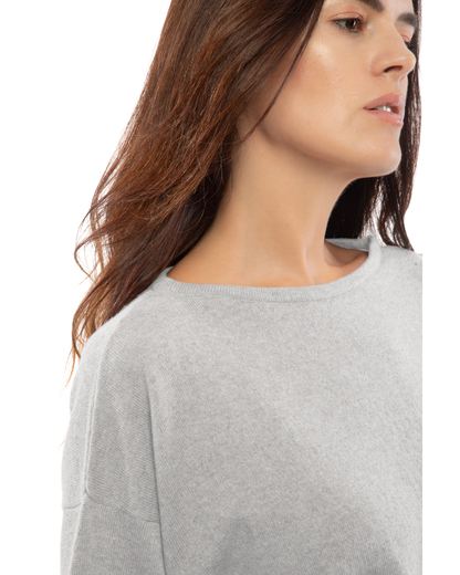 Close-up of the light gray cashmere sweater's boat neckline