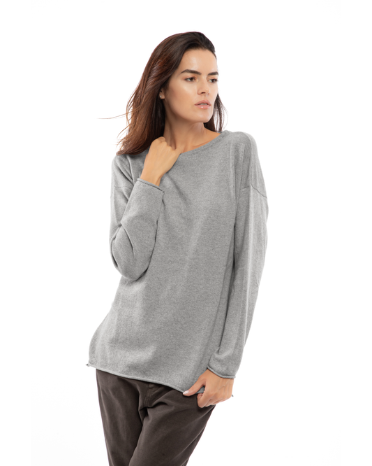 Model wearing a cashmere relaxed maxi boatneck sweater in melange gray, front view