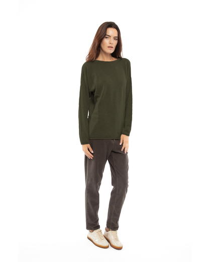Model wearing a cashmere relaxed maxi boatneck sweater in olive green, front view