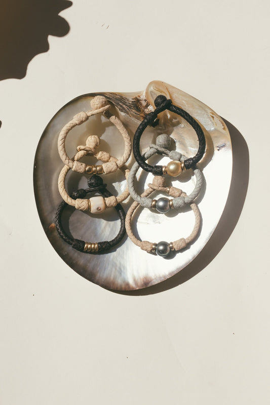 MARQUESAS 14K GOLD BRACELET on a sea shell