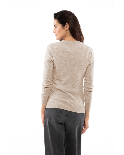 Beige cashmere crewneck cardigan, rear three-quarter view on a model