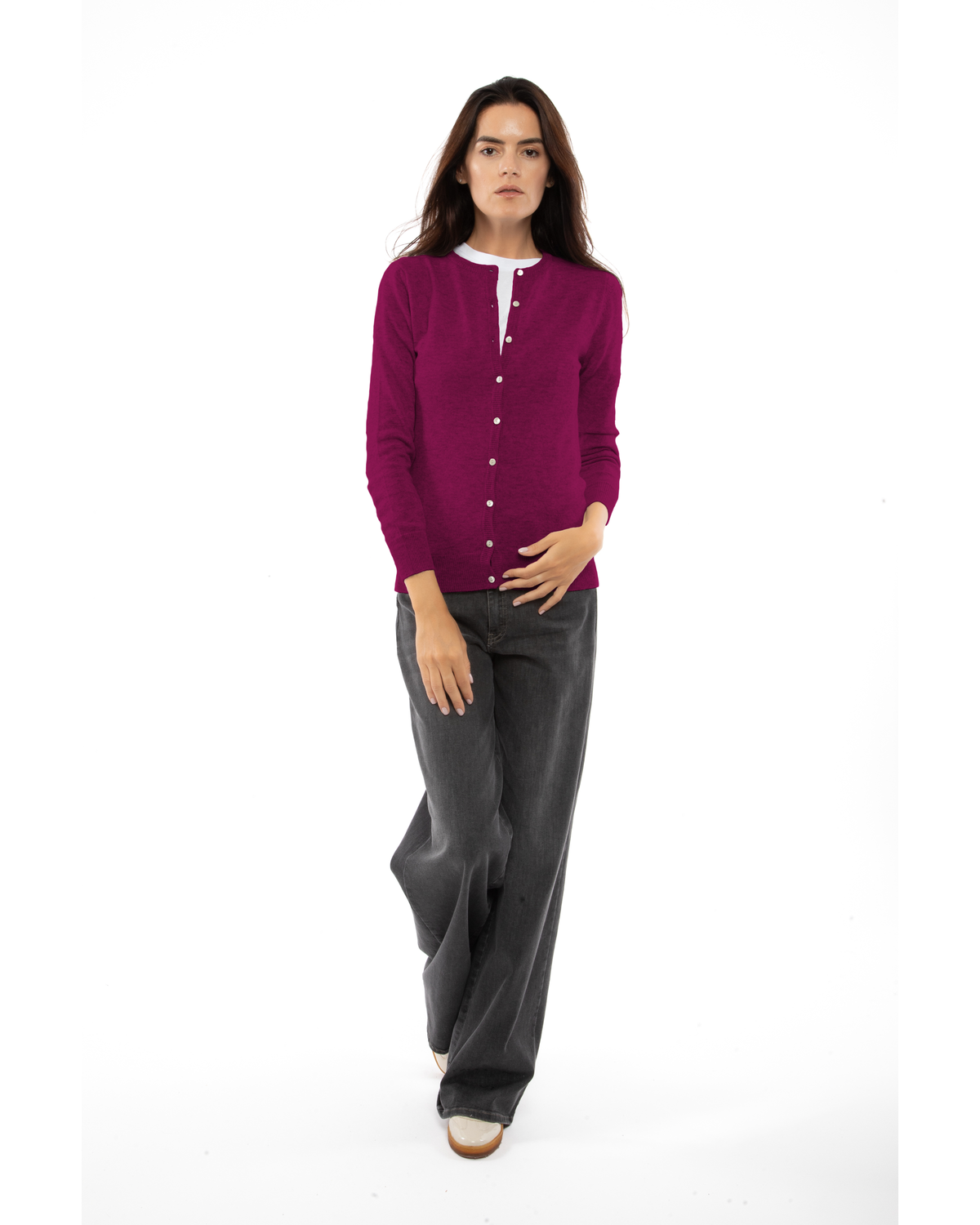 Magenta cashmere crewneck cardigan, full-length front view styled with dark trousers