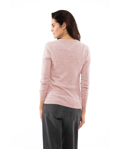 Old Rose cashmere crewneck cardigan, rear three-quarter view on a model