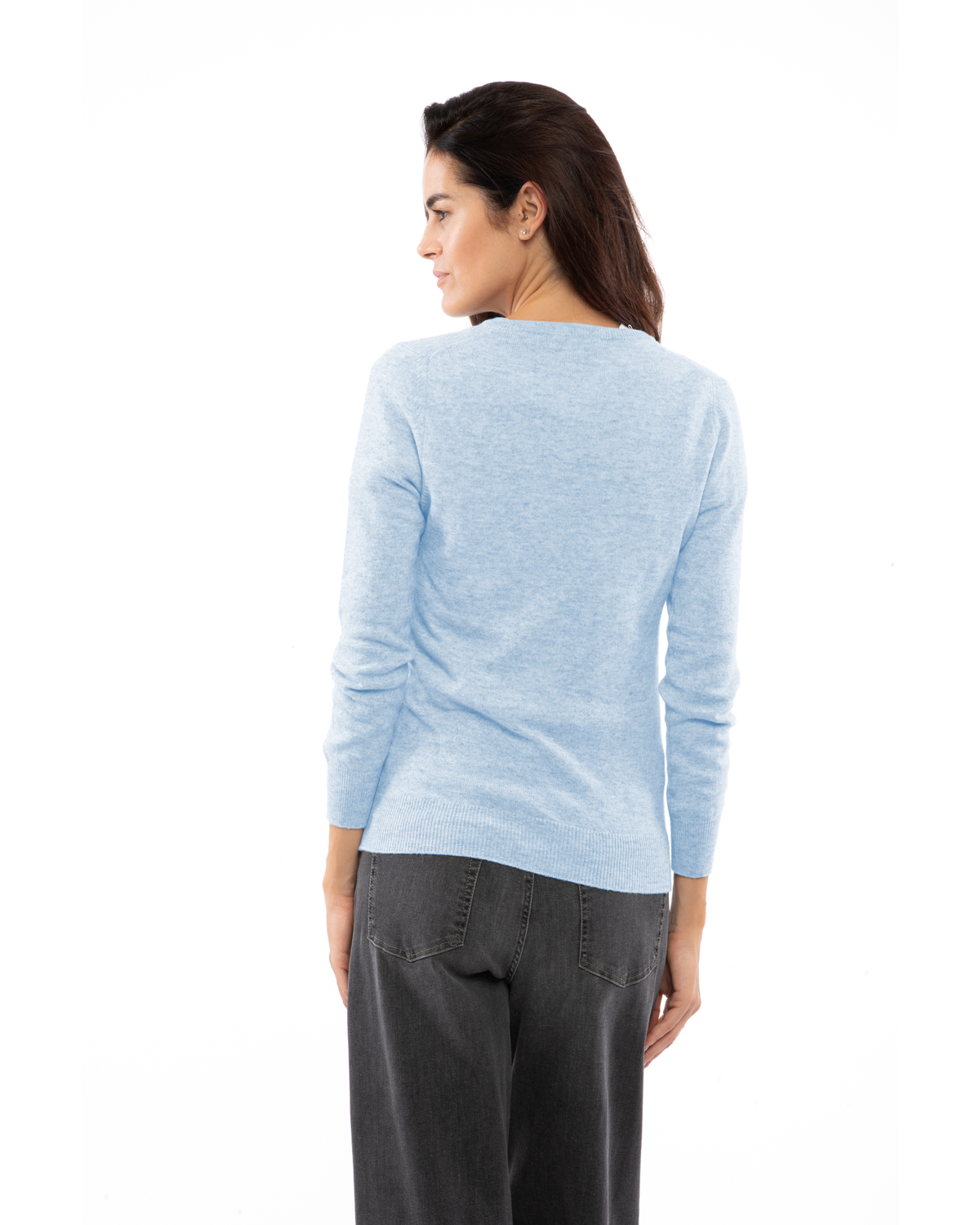 Baby Blue cashmere crewneck cardigan, rear three-quarter view on a model