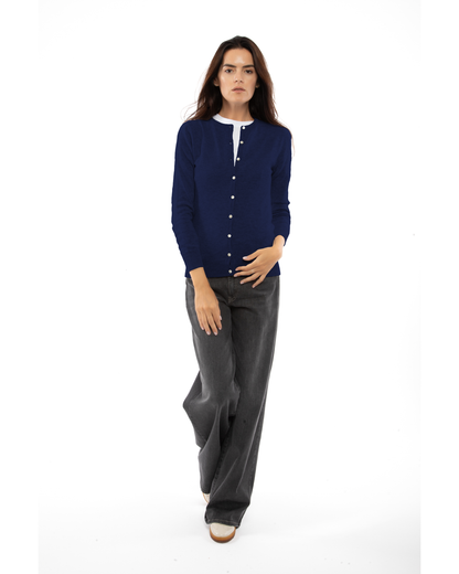 Blue cashmere crewneck cardigan, full-length front view styled with dark trousers