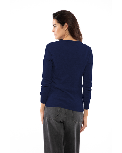 Blue cashmere crewneck cardigan, rear three-quarter view on a model