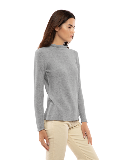 Women's cashmere links stitch funnel neck sweater in Medium Gray, three-quarter view on a model
