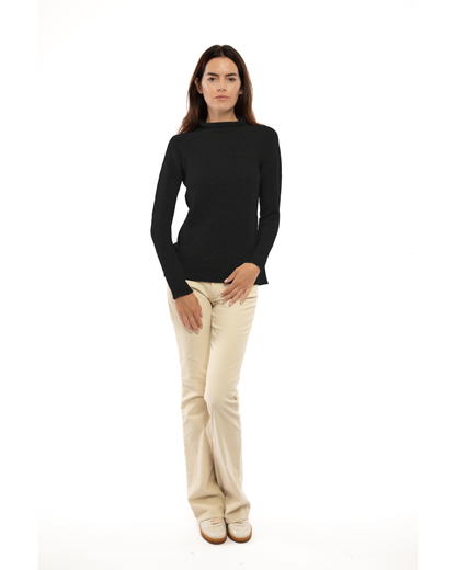 Women's cashmere links stitch funnel neck sweater in Black, full-length view on a model