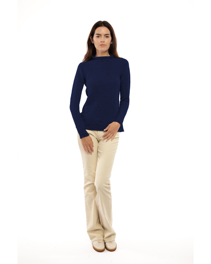 Women's cashmere links stitch funnel neck sweater in Blue, full-length view on a model