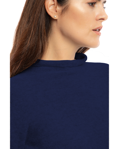 Women's cashmere links stitch funnel neck sweater in Blue, close-up of the funnel neckline and links stitch
