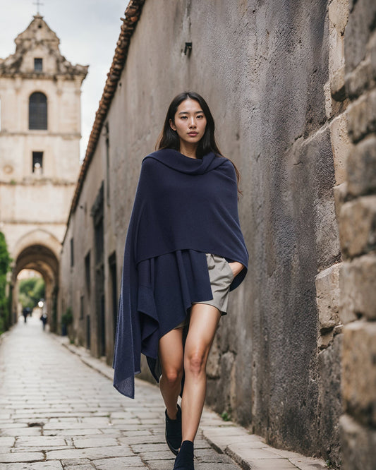 Model wearing the blue cashmere wrap draped around her shoulders outdoors
