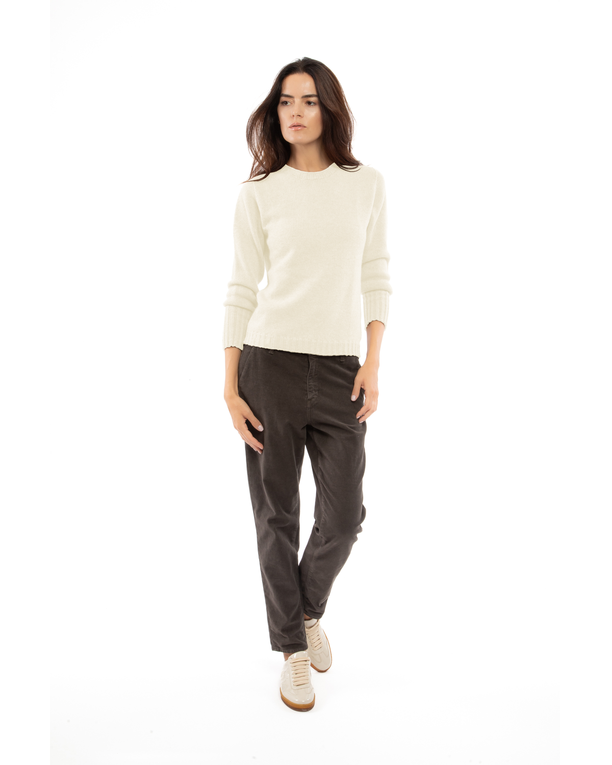 Model wearing a cashmere ribbed-trim crewneck sweater in milk white, front view