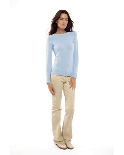 Model wearing the baby blue cashmere raglan crewneck sweater