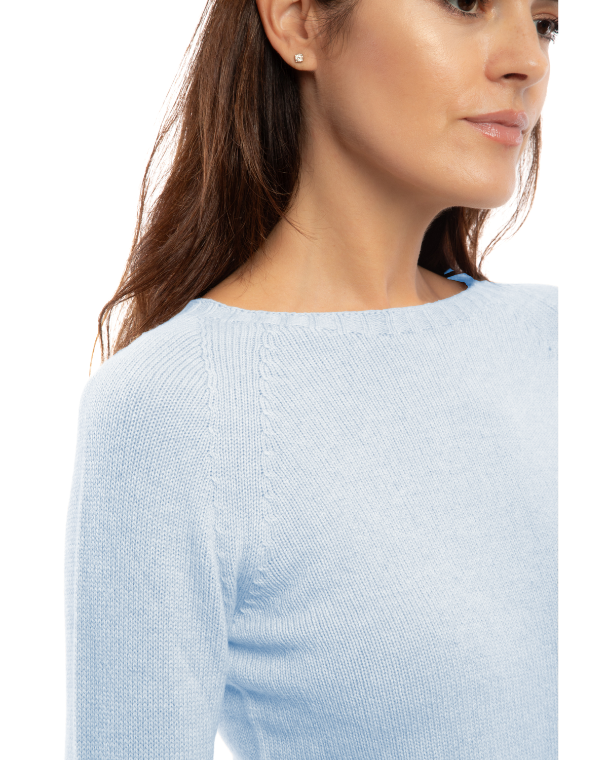 Close-up of the neckline of a cashmere raglan crewneck sweater in baby blue