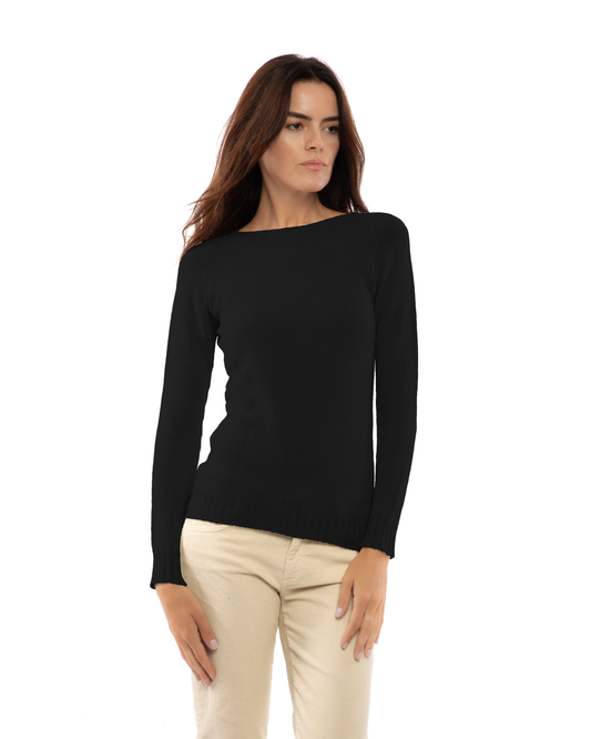 Black cashmere raglan crewneck sweater, three-quarter view on a model.