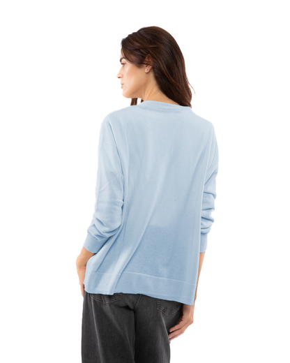 Women's cashmere oversized cardigan in Baby Blue, back view on model
