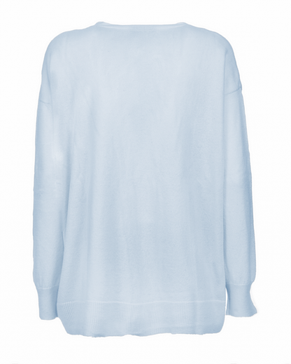 Women's cashmere oversized cardigan in Baby Blue, back garment view showing the relaxed shape and hem