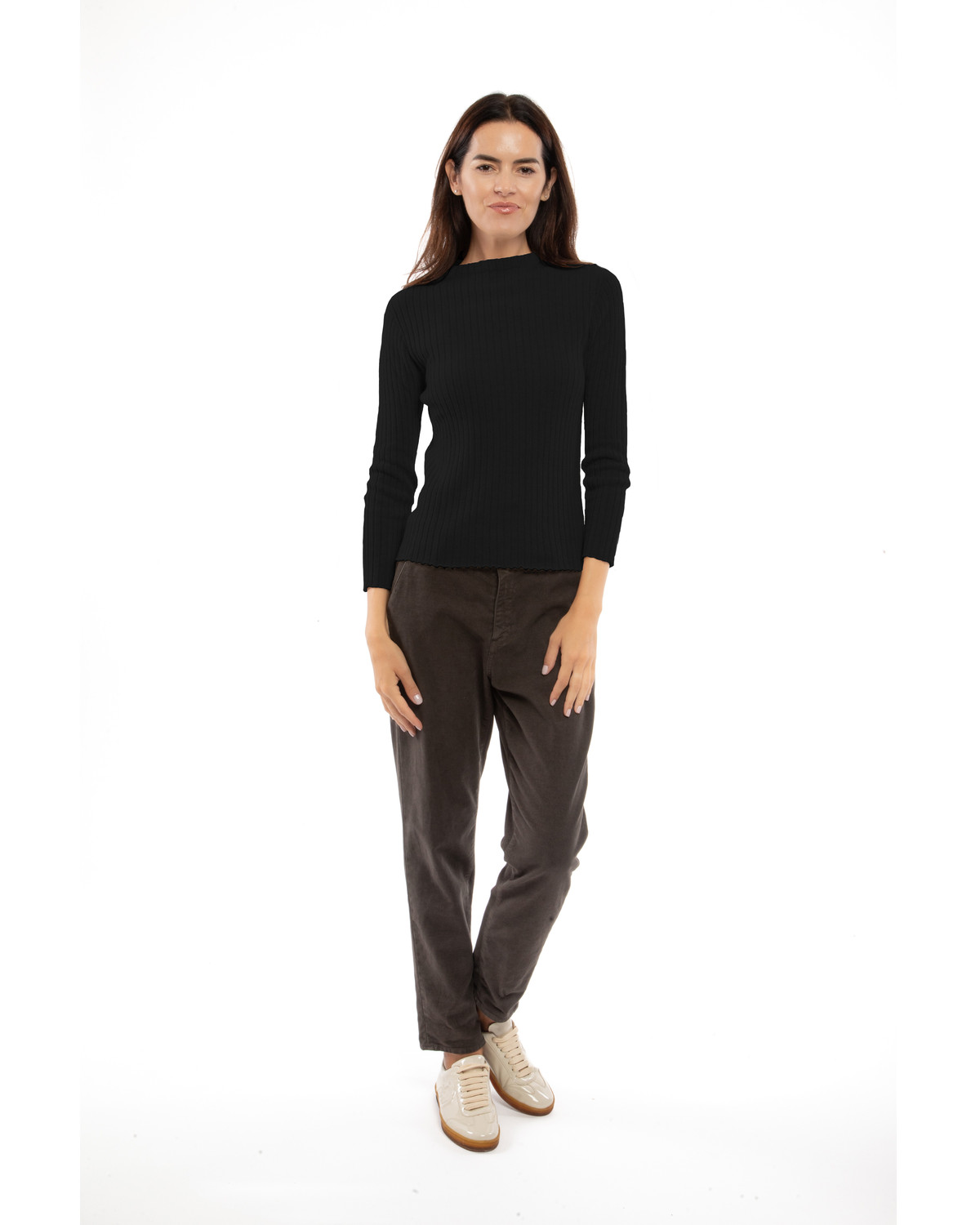 Black cashmere ribbed crewneck sweater, shown from the front on a model.