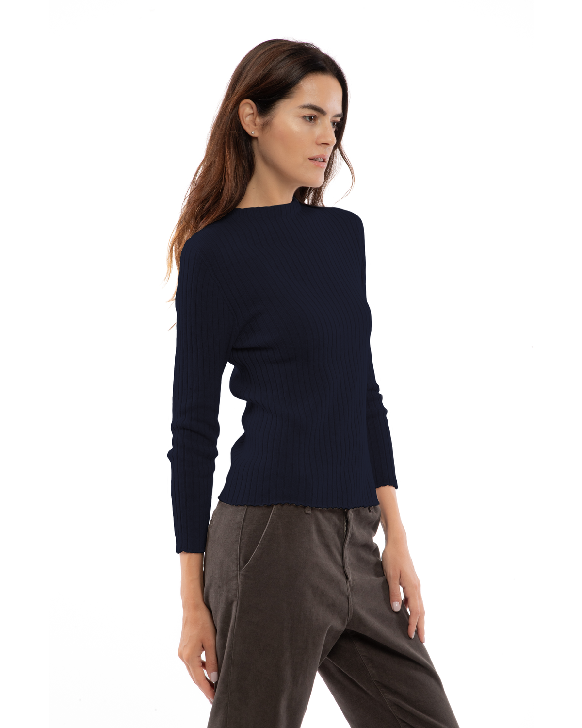 Night blue cashmere ribbed crewneck sweater, shown at an angle on a model.