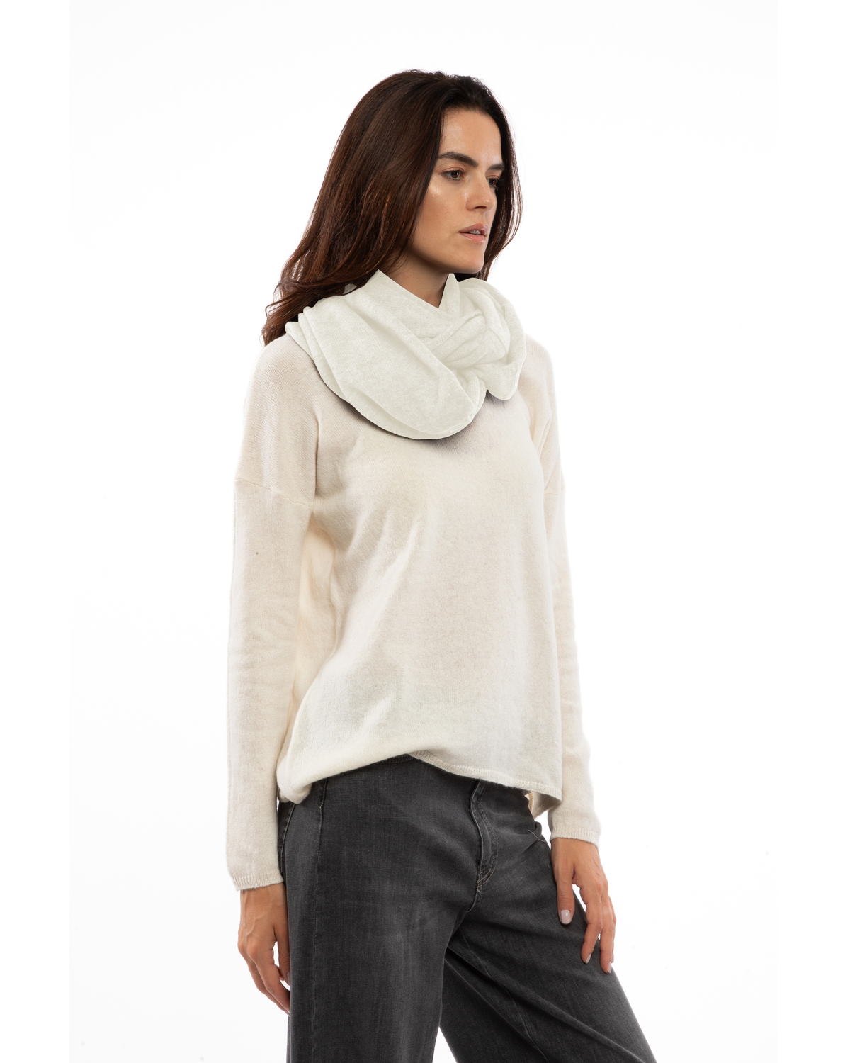 Side view of the milk white cashmere infinity scarf on a model