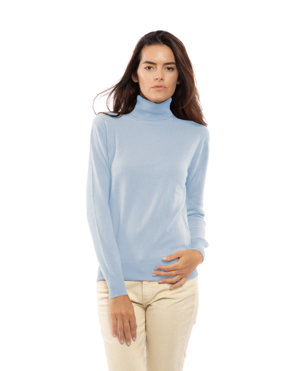 Baby Blue cashmere turtleneck sweater, front view on a model showing the long sleeves and ribbed hem.