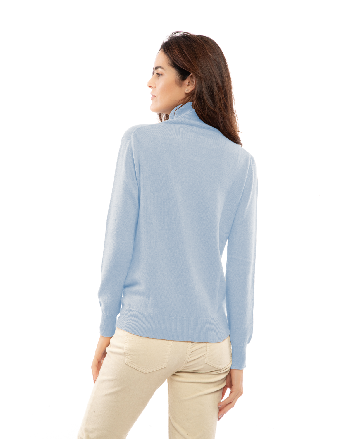 Baby Blue cashmere turtleneck sweater, back view on a model showing the shoulders and ribbed hem.