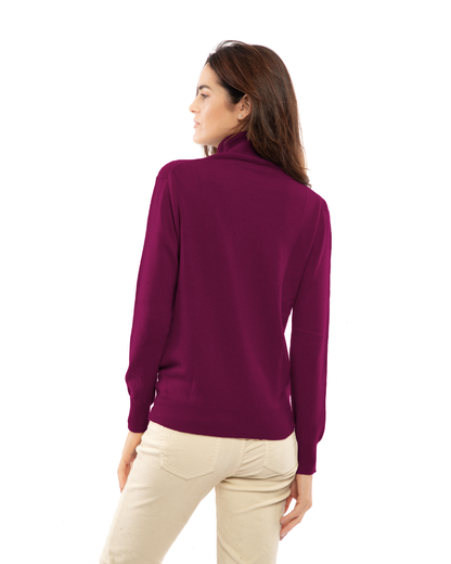 Women's cashmere turtleneck sweater in Magenta, back view on model