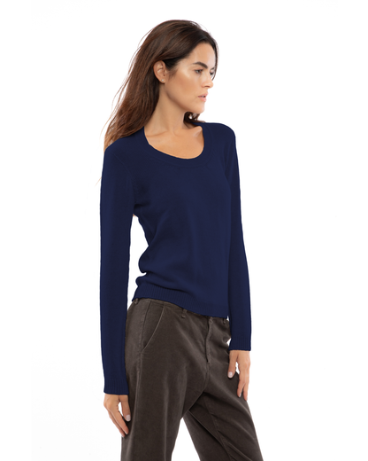 Blue cashmere scoop-neck sweater, shown at an angle on a model.