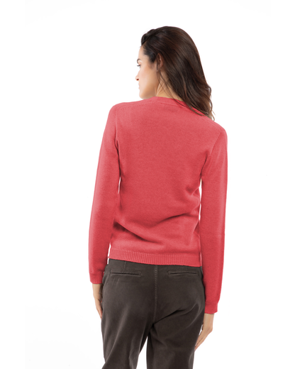 Back view of a model wearing a cashmere scoop-neck sweater in coral red