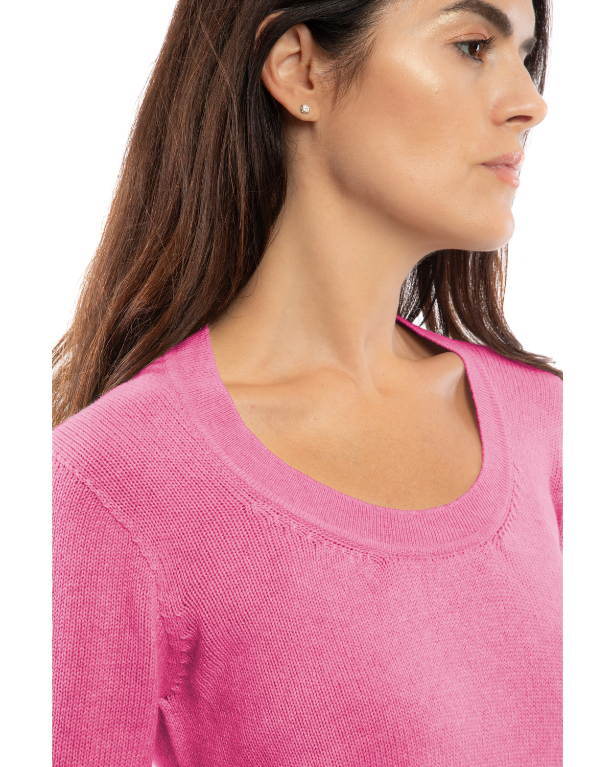 Close-up of the neckline of a cashmere scoop-neck sweater in fuchsia