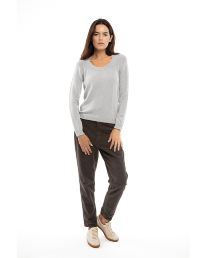 Model wearing the light gray cashmere scoop-neck sweater