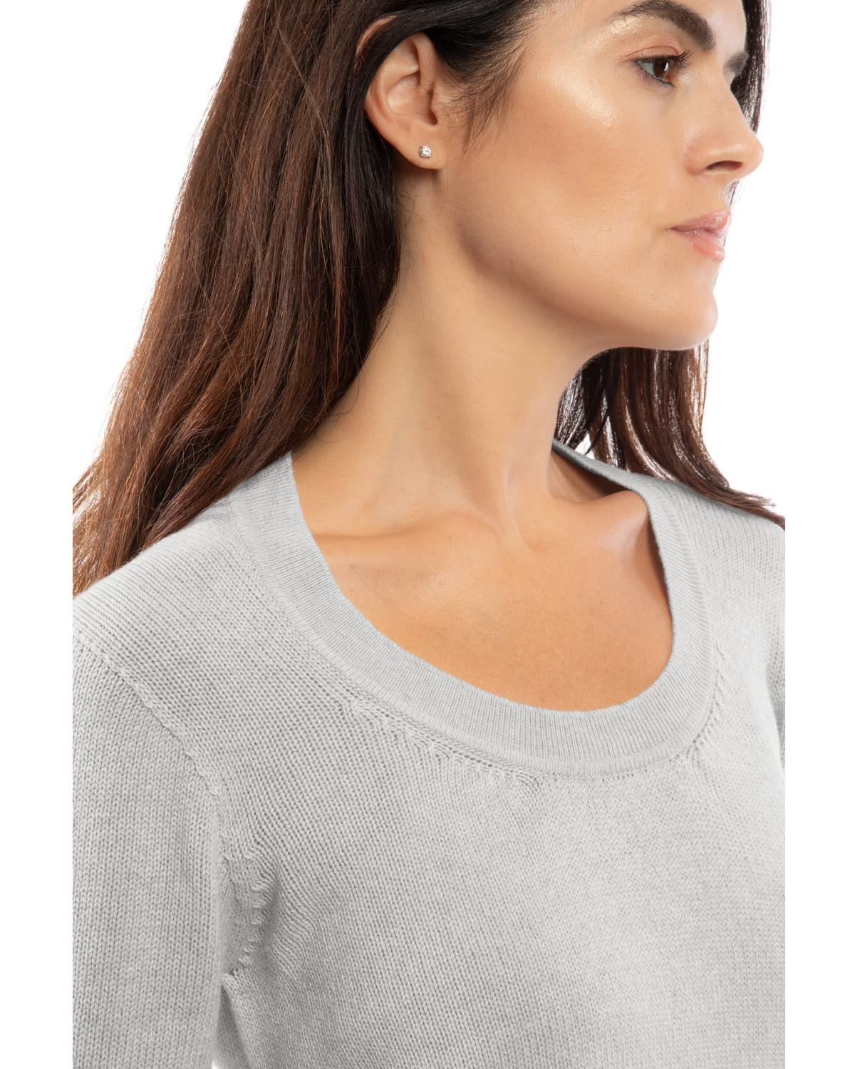 Close-up of the neckline of a cashmere scoop-neck sweater in light gray