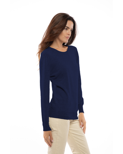 Blue pure cashmere classic crewneck sweater, three-quarter view on a model.