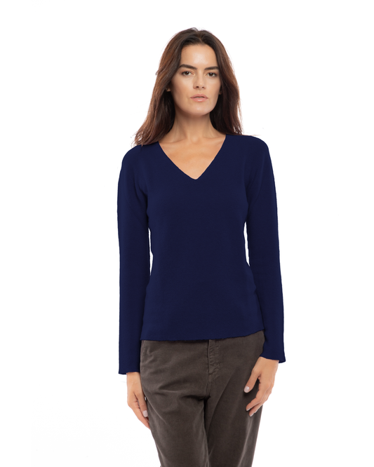 Blue pure cashmere links-stitch V-neck sweater, model view.