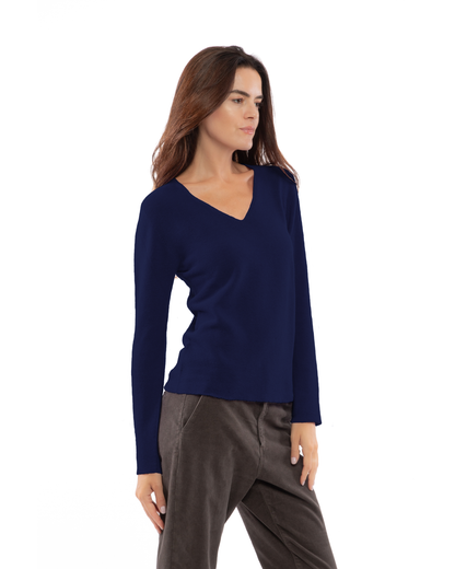Blue pure cashmere links-stitch V-neck sweater, three-quarter view on a model.