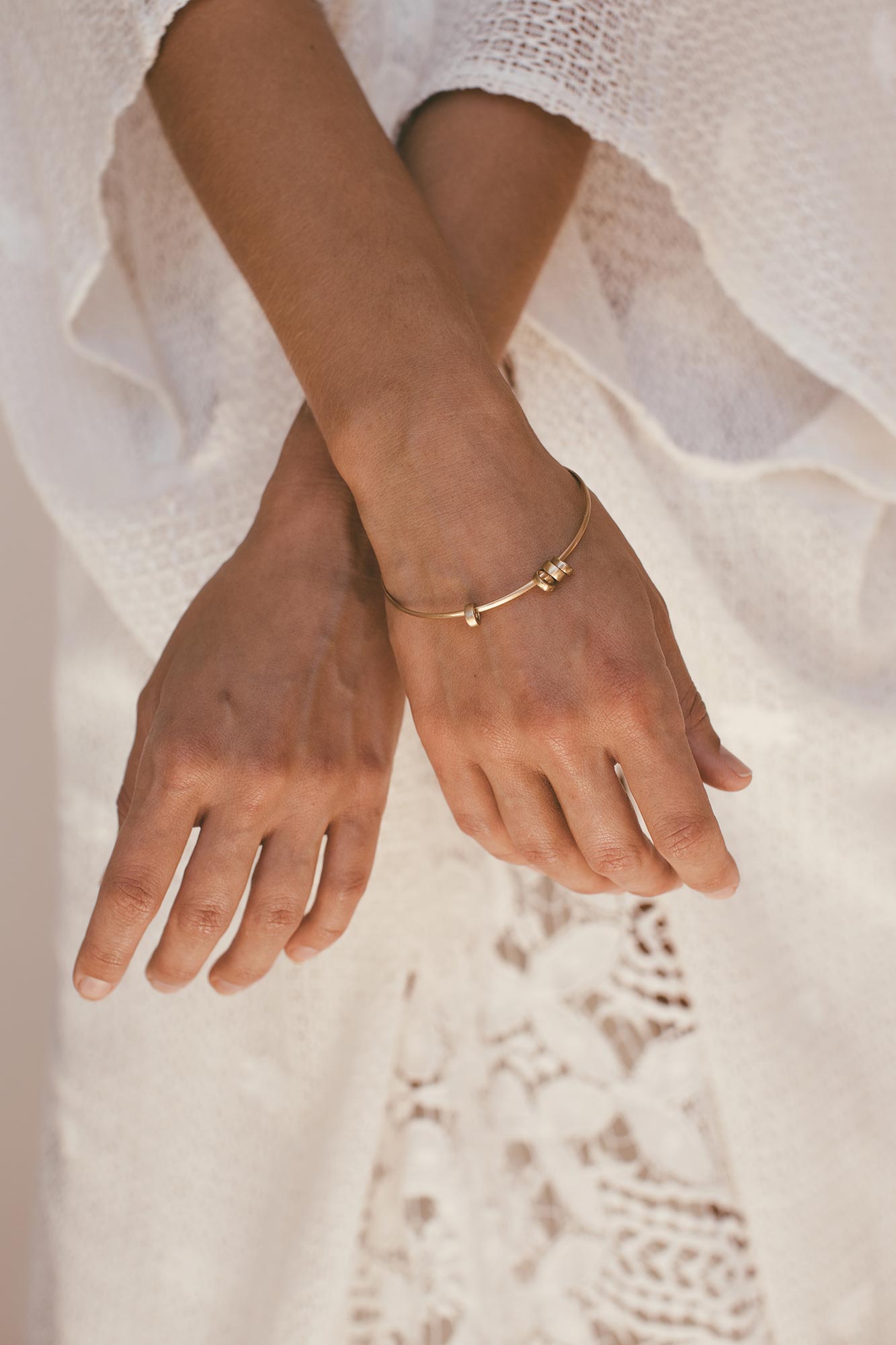 Quatro bangle worn on wrist of model