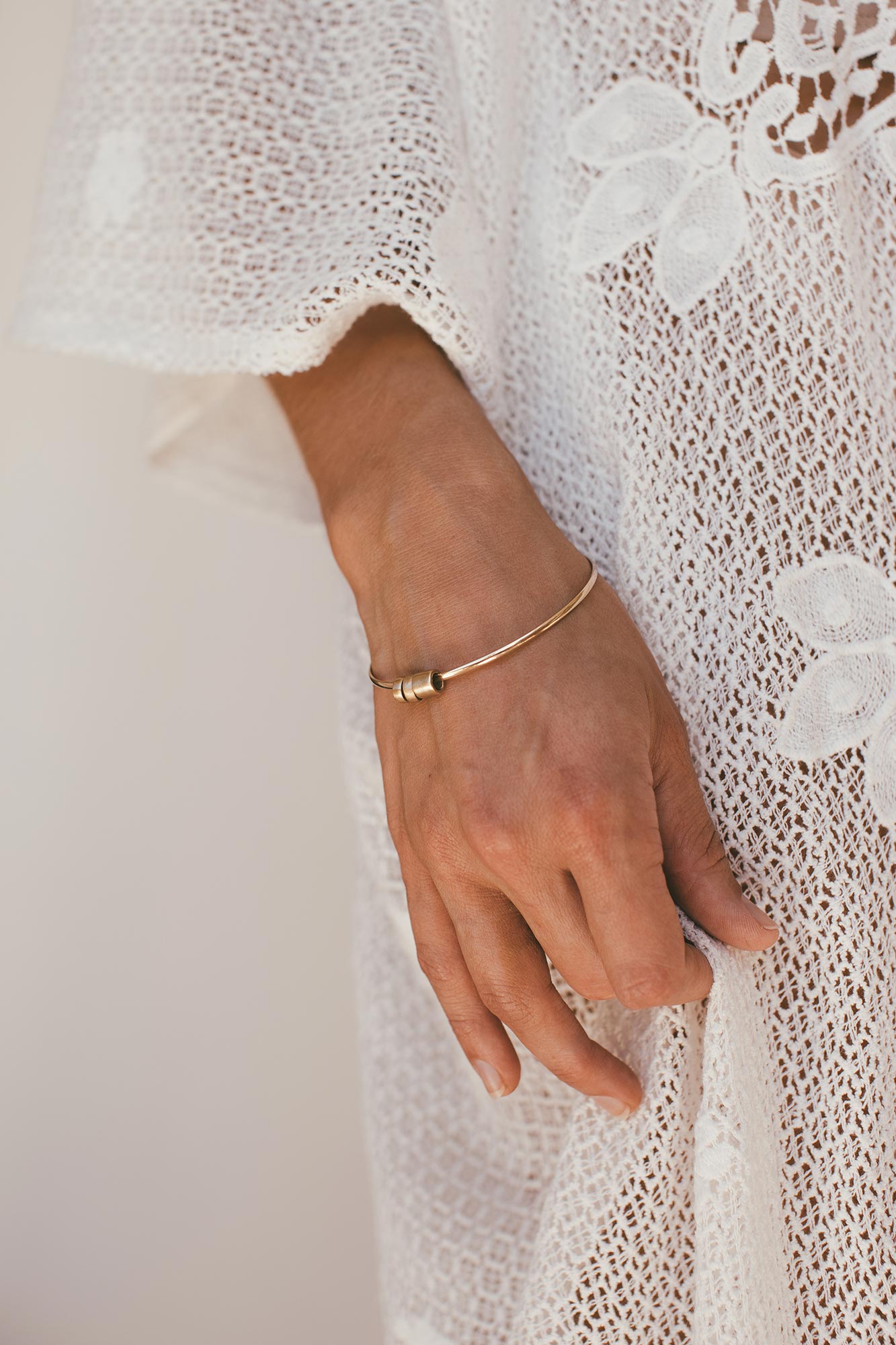 Quatro bangle worn on wrist