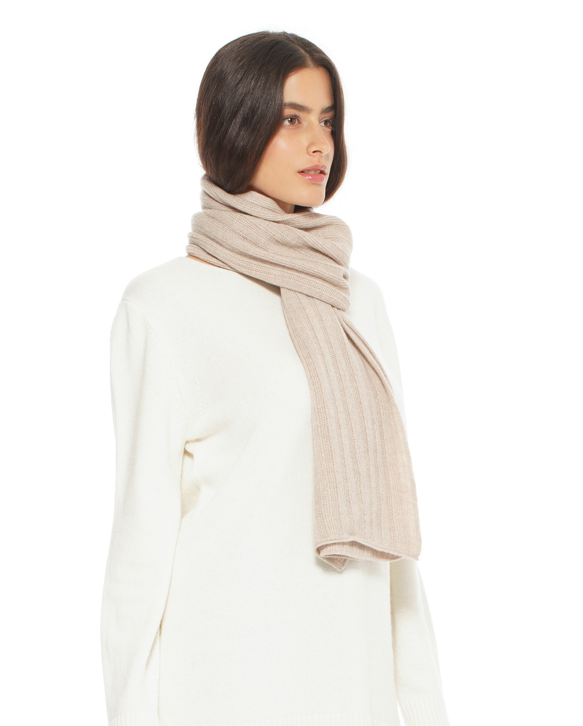 Woman wearing a beige scarf on a white background