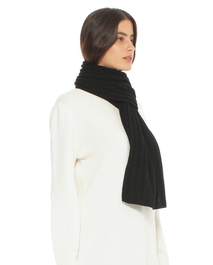 Woman wearing a black scarf on a white background