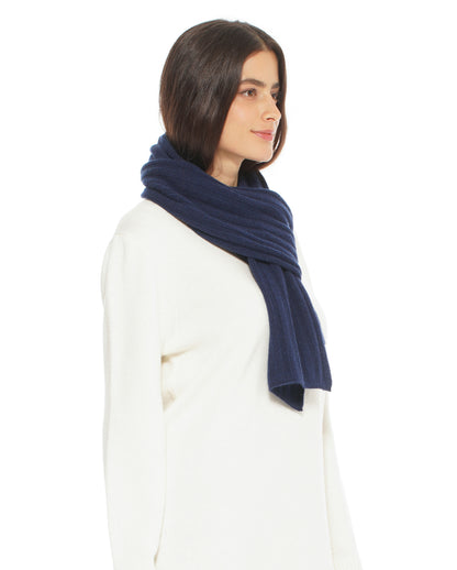 Woman wearing a blue scarf on a white background